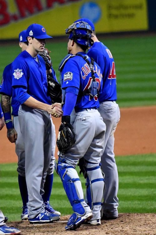 Chicago Cubs catcher WILSON CONTRERAS shakes the hand of starting pitcher KYLE HENDRICKS