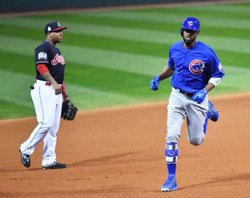 Chicago Cubs outfielder DEXTER FOWLER rounds third base after hitting a home run