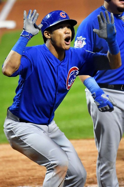 Chicago Cubs ADDISON RUSSELL celebrates hitting a grand slam home run