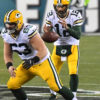 Green Bay Packers quarterback AARON RODGERS takes the snap