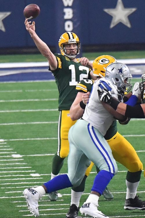 Green Bay Packers quarterback AARON ROGERS completes pass