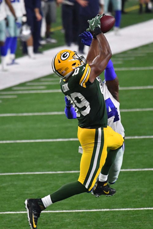 Green Bay Packers tight end JARED COOK makes a leaping catch