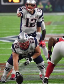 New England Patriots quarterback, Tom Brady, points the way