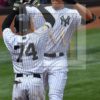 New York Yankees AARON JUDGE high fives RONALD TORREYES after hitting his first career grand slam home run off of Oakland Athletics starting pitcher Andrew Triggs, JUDGE'S 16th home run of the year and his 34th RBI. jUDGE went 2 for 4 leading the Yankees to a 9-5 victory.