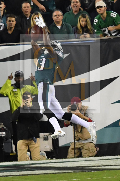 Eagles NELSON AGHOLOR makes a leaping catch, pic 1 of 3 in series