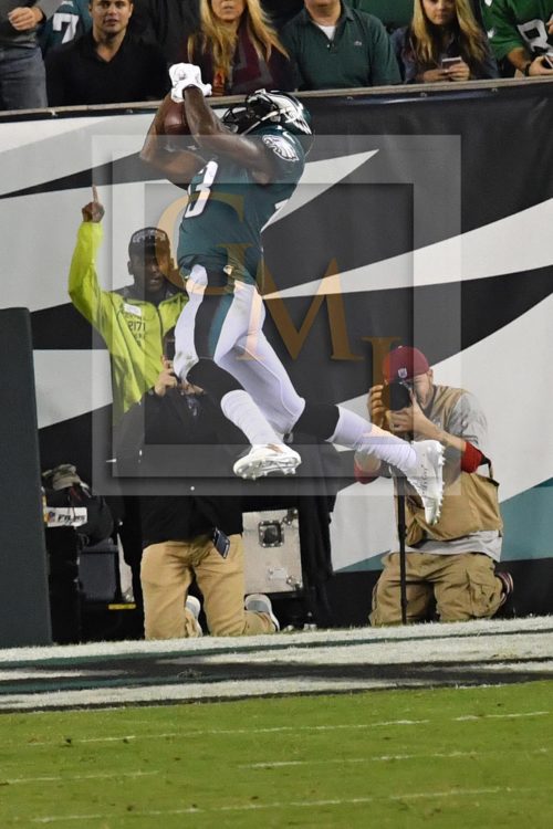 Eagles NELSON AGHOLOR makes a leaping catch, pic 2 of 3 in series