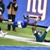 Giants wide receiver TAVARRES KING leaps into the end zone