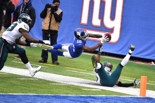 Giants wide receiver TAVARRES KING leaps into the end zone