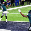 Eagles quarterback NICK FOLES receives a touchdown pass just before half time