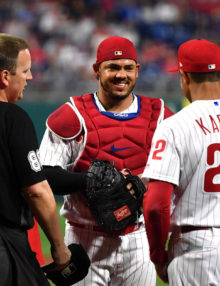 Phillies catcher Jorge Alfaro flashes a smile to Phillies manager Gabe Kapler