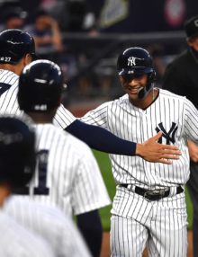 Yankees Glyber Torres congratulated by his teammates after hitting his major league leading sixth 3-run home run