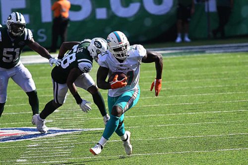 Miami Dolphins running back Frank Gore gains 19 yards