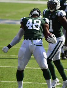 New York Jets linebacker Jordan Jenkins celebrates forcing and recovering a fumble