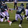 Eagles quarterback Carson Wentz pitches out to running back Wendell Smallwood