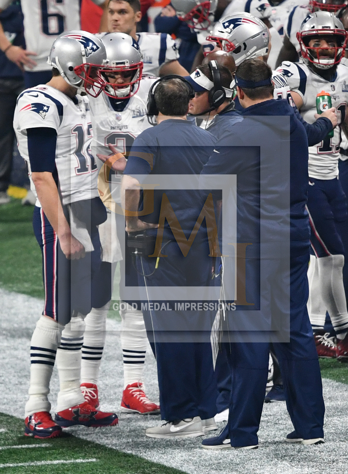 Coach Bill Belichick talks to Tom Brady at Super Bowl LIII