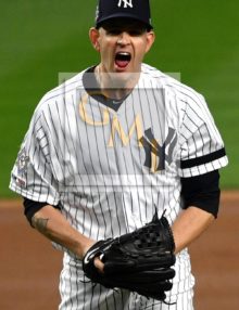 New York Yankees James Paxton celebrates striking out the side in the seventh inning