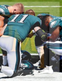 Prior to the Eagles first home game Carson Wentz leads a prayer with Zach Ertz, Darren Sproles, and Corey Clement