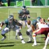 Philadelphia Eagles quarterback, Carson Wentz, takes the snap from center Jason Kelce