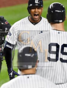 Yankees Aaron Hicks celebrates hitting a three-run home run